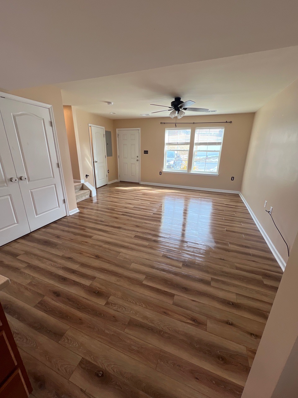 empty living room with clean floors ready after move out cleaning